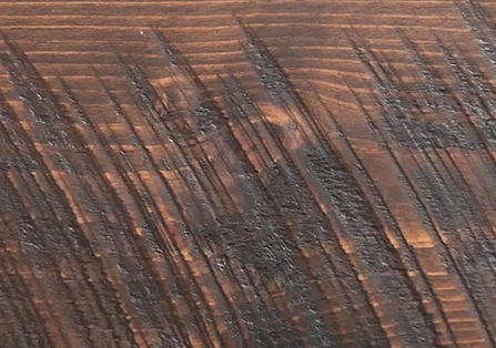 Burnished russet color with saw marks